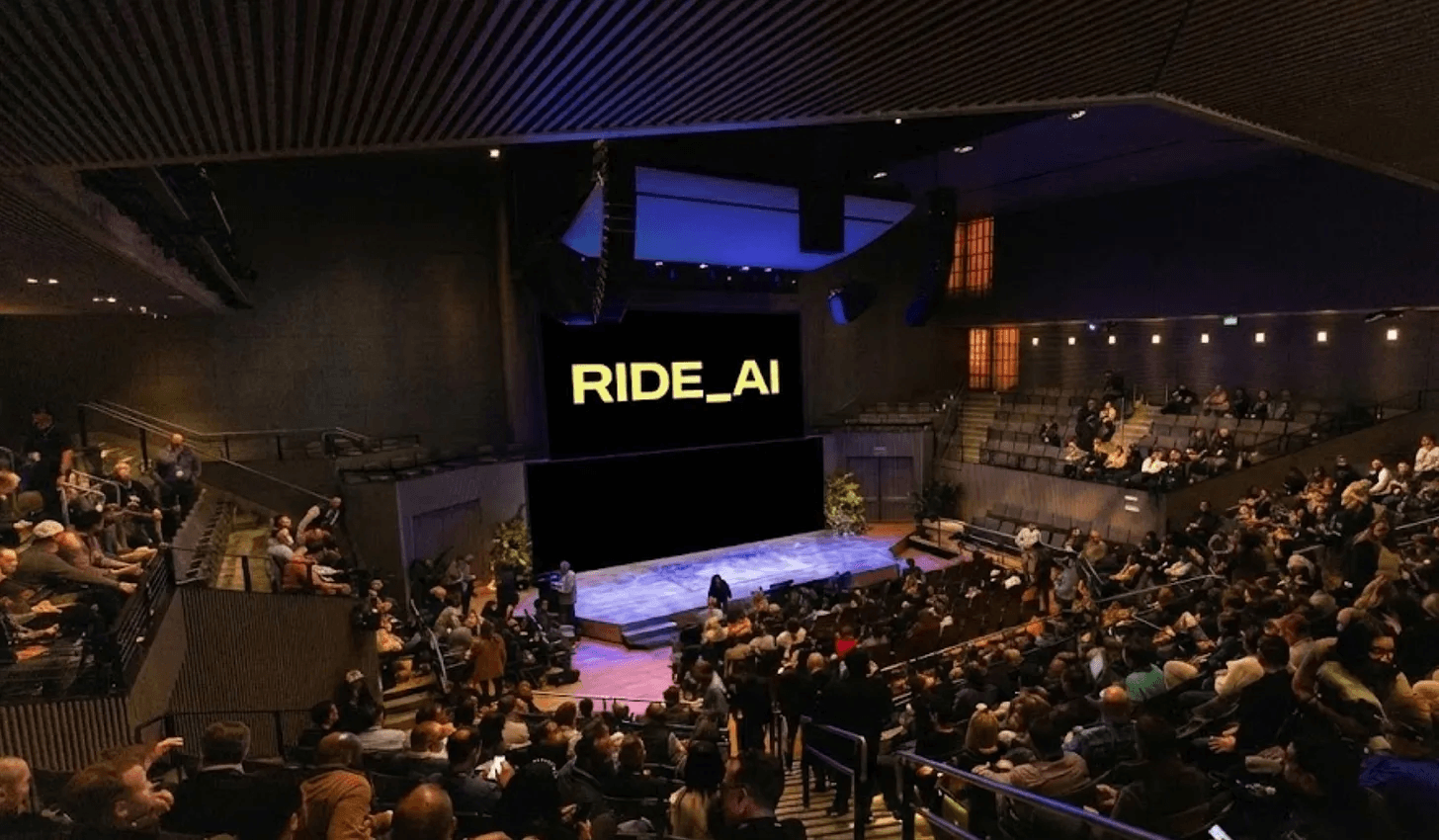 RIDE AI conference stage setup with yellow branding at SFJAZZ Center